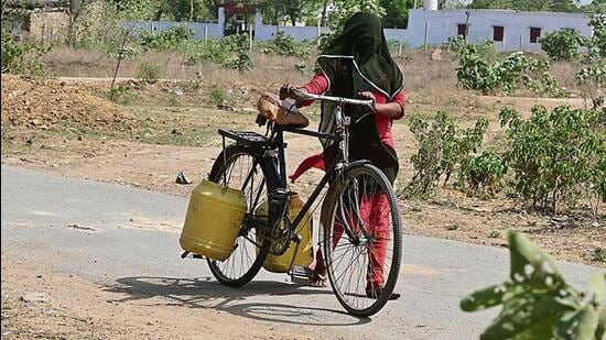 A-girl-fetches-water-from-faraway-HT-Photo-_1780948702116