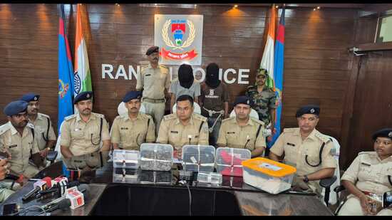 Police-with-two-of-the-accused-in-the-RSS-office-b_1781806583562