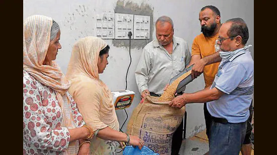 Ration-depot-holders-distributing-foodgrains-to-th_1780850808717