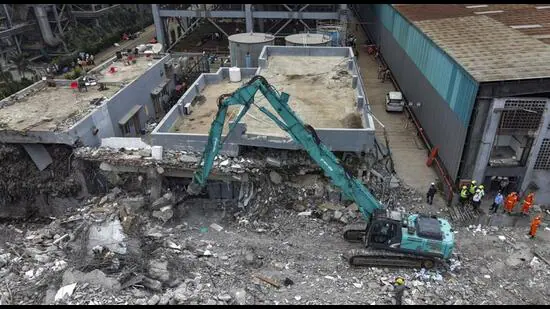 Moshi-An-earth-mover-removes-debris-at-the-site-a_1784054210813