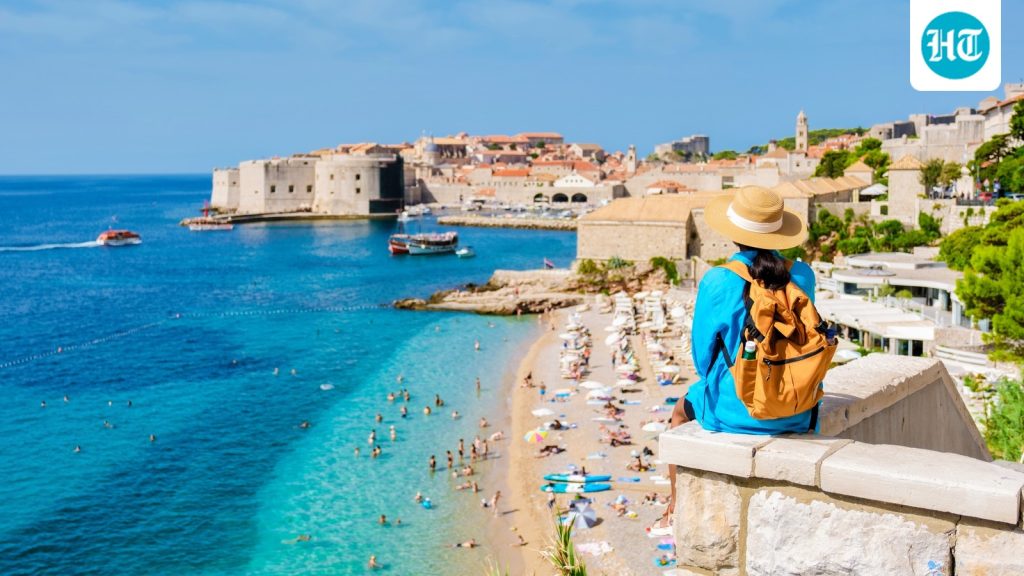 A,Traveler,Gazes,Out,At,The,Dazzling,Adriatic,Sea,From